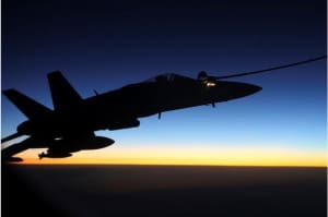 An F/A-18A Hornet from Australia's Air Task Group refuels at sunset from a RAAF KC-30A Multi Role Tanker Transport aircraft during the first mission of Operation OKRA to be flown over Syria. Credit: Defence